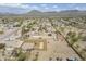 Aerial view showcasing desert property, RV, and mountain views in the distance at 907 N Mountain Rd, Mesa, AZ 85207