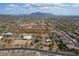 Scenic aerial view of neighborhood featuring desert landscape, mountains in the background, and beautiful homes at 907 N Mountain Rd, Mesa, AZ 85207