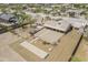 Aerial view showcases outdoor living spaces including an outdoor kitchen, patio, bocce ball court, and pergola at 907 N Mountain Rd, Mesa, AZ 85207