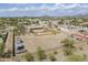 Expansive aerial view of the property showcasing a large lot, desert landscaping, and single story house at 907 N Mountain Rd, Mesa, AZ 85207