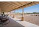 Spacious covered back patio and gravel backyard offering shade and outdoor relaxation at 907 N Mountain Rd, Mesa, AZ 85207