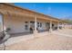 Long covered back patio with gravel backyard featuring seating areas at 907 N Mountain Rd, Mesa, AZ 85207