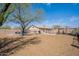 Landscaped backyard featuring hammock, outdoor grill, and fire pit at 907 N Mountain Rd, Mesa, AZ 85207