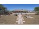 Single-story home featuring a brick-paver pathway and wood-chip landscaping at 907 N Mountain Rd, Mesa, AZ 85207