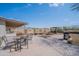Spacious backyard featuring a patio with outdoor seating, a built-in fire pit, and a barbecue grill at 907 N Mountain Rd, Mesa, AZ 85207