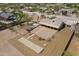 Aerial view showcasing a bocce ball court, landscaped backyard, covered patio, and desert-style landscaping at 907 N Mountain Rd, Mesa, AZ 85207
