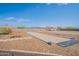 Large backyard with horseshoe pits and a bocce ball court, perfect for outdoor recreation and activities at 907 N Mountain Rd, Mesa, AZ 85207