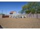 Backyard features an outbuilding and a spacious yard, providing ample storage or workshop space at 907 N Mountain Rd, Mesa, AZ 85207