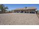 Single-story home with a covered patio and gravel landscaping at 907 N Mountain Rd, Mesa, AZ 85207