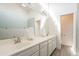 Bathroom with double sink vanity, wall to wall mirror, and neutral decor at 907 N Mountain Rd, Mesa, AZ 85207
