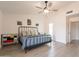 Bedroom with black metal bed, colorful dressers, closet access, and access to other rooms at 907 N Mountain Rd, Mesa, AZ 85207