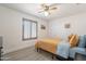 Cozy bedroom featuring a ceiling fan and shuttered window at 907 N Mountain Rd, Mesa, AZ 85207