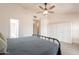 Bedroom featuring a bed with white linen closet storage and access to other rooms at 907 N Mountain Rd, Mesa, AZ 85207