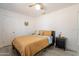 Bedroom boasting a ceiling fan, neutral decor, and comfortable furnishings at 907 N Mountain Rd, Mesa, AZ 85207