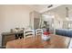Dining room with wood table, seating for four, and a view of the kitchen at 907 N Mountain Rd, Mesa, AZ 85207