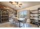 Bright dining room featuring a decorative wood wall, wine cabinet, and seating for six at 907 N Mountain Rd, Mesa, AZ 85207