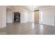 The entryway boasts wood-style tile, neutral walls, and a transom window at the front door at 907 N Mountain Rd, Mesa, AZ 85207