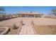 Charming single-story home with a tile roof, desert landscaping, and a brick walkway leading to the front entrance at 907 N Mountain Rd, Mesa, AZ 85207