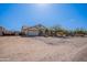 Lovely single-story home featuring a well-kept yard, attached garage, and mature landscaping at 907 N Mountain Rd, Mesa, AZ 85207