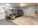 A large, organized two car garage with a parked gray Jeep and shelving along the back wall at 907 N Mountain Rd, Mesa, AZ 85207