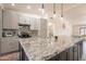 Bright kitchen with granite countertops, stainless steel appliances, and gray cabinets at 907 N Mountain Rd, Mesa, AZ 85207