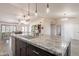 Large kitchen island with granite countertop, modern faucet, and pendant lighting at 907 N Mountain Rd, Mesa, AZ 85207