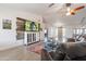 Spacious living room with wood-style tile, TV feature wall, and open layout at 907 N Mountain Rd, Mesa, AZ 85207
