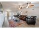 Open living area with tile floors, leather seating, and easy access to dining and kitchen at 907 N Mountain Rd, Mesa, AZ 85207