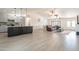Bright, open-concept living space with tile flooring, modern kitchen, and comfortable living room at 907 N Mountain Rd, Mesa, AZ 85207