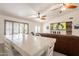 An open-concept area with living, dining, and kitchen areas with plenty of natural light at 907 N Mountain Rd, Mesa, AZ 85207