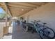 Spacious, covered patio offering ample room for seating and outdoor activities with backyard view at 907 N Mountain Rd, Mesa, AZ 85207