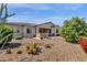 Stunning backyard featuring desert landscaping, covered patio, and built-in outdoor kitchen at 10350 E Texas Ave, Mesa, AZ 85212