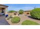 Desert landscaped backyard with outdoor grill and dining area on the paved patio at 10350 E Texas Ave, Mesa, AZ 85212