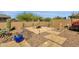 Relaxing backyard featuring a fire pit, desert landscaping and stone pavers at 10350 E Texas Ave, Mesa, AZ 85212