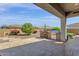 Outdoor kitchen area with a built-in grill and bar seating at 10350 E Texas Ave, Mesa, AZ 85212