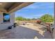 Scenic backyard area with an outdoor kitchen and desert landscaping at 10350 E Texas Ave, Mesa, AZ 85212