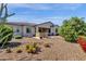 Expansive backyard with desert landscaping, covered patio, built-in barbecue, and seating area at 10350 E Texas Ave, Mesa, AZ 85212