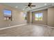 Bright bedroom with neutral walls and multiple windows providing abundant natural light and desert views at 10350 E Texas Ave, Mesa, AZ 85212