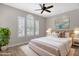 Comfortable bedroom with plantation shutters and cozy decor, a perfect retreat at 10350 E Texas Ave, Mesa, AZ 85212
