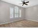 Bedroom with plantation shutters, ceiling fan and neutral colored walls at 10350 E Texas Ave, Mesa, AZ 85212