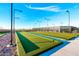 Scenic bocce ball court with pristine artificial turf under a clear blue sky at 10350 E Texas Ave, Mesa, AZ 85212