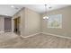 Well-lit dining area featuring stylish lighting and a sliding glass door for natural light at 10350 E Texas Ave, Mesa, AZ 85212