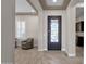 Foyer featuring an ornate front door, shuttered windows, and wood look tile flooring at 10350 E Texas Ave, Mesa, AZ 85212