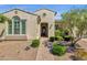 Home featuring desert landscaping, decorative front door, and a brick walkway at 10350 E Texas Ave, Mesa, AZ 85212