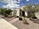 Charming home featuring desert landscaping, a brick walkway, and a well-manicured yard at 10350 E Texas Ave, Mesa, AZ 85212
