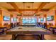 Spacious game room provides ample seating, multiple TVs, and billiards for entertainment and leisure at 10350 E Texas Ave, Mesa, AZ 85212