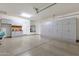 Spacious garage with epoxy floors, and ample cabinet storage at 10350 E Texas Ave, Mesa, AZ 85212