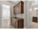 Hallway with cabinets and view into other rooms at 10350 E Texas Ave, Mesa, AZ 85212