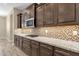 Well-organized kitchen with granite countertops, stainless steel appliances, and mosaic tile backsplash at 10350 E Texas Ave, Mesa, AZ 85212