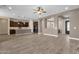 Open concept living room with hardwood floors flowing into the kitchen area at 10350 E Texas Ave, Mesa, AZ 85212